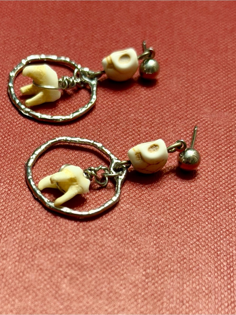 Raccoon teeth skelly earrings